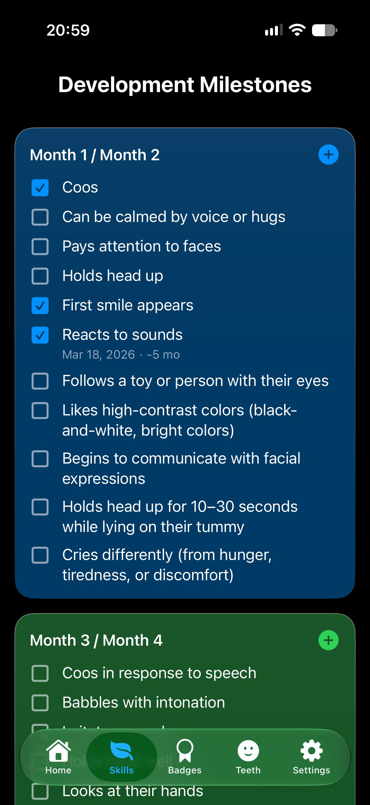 Development milestones checklist for months 1 and 2, with coos, first smile and reacting to sounds ticked