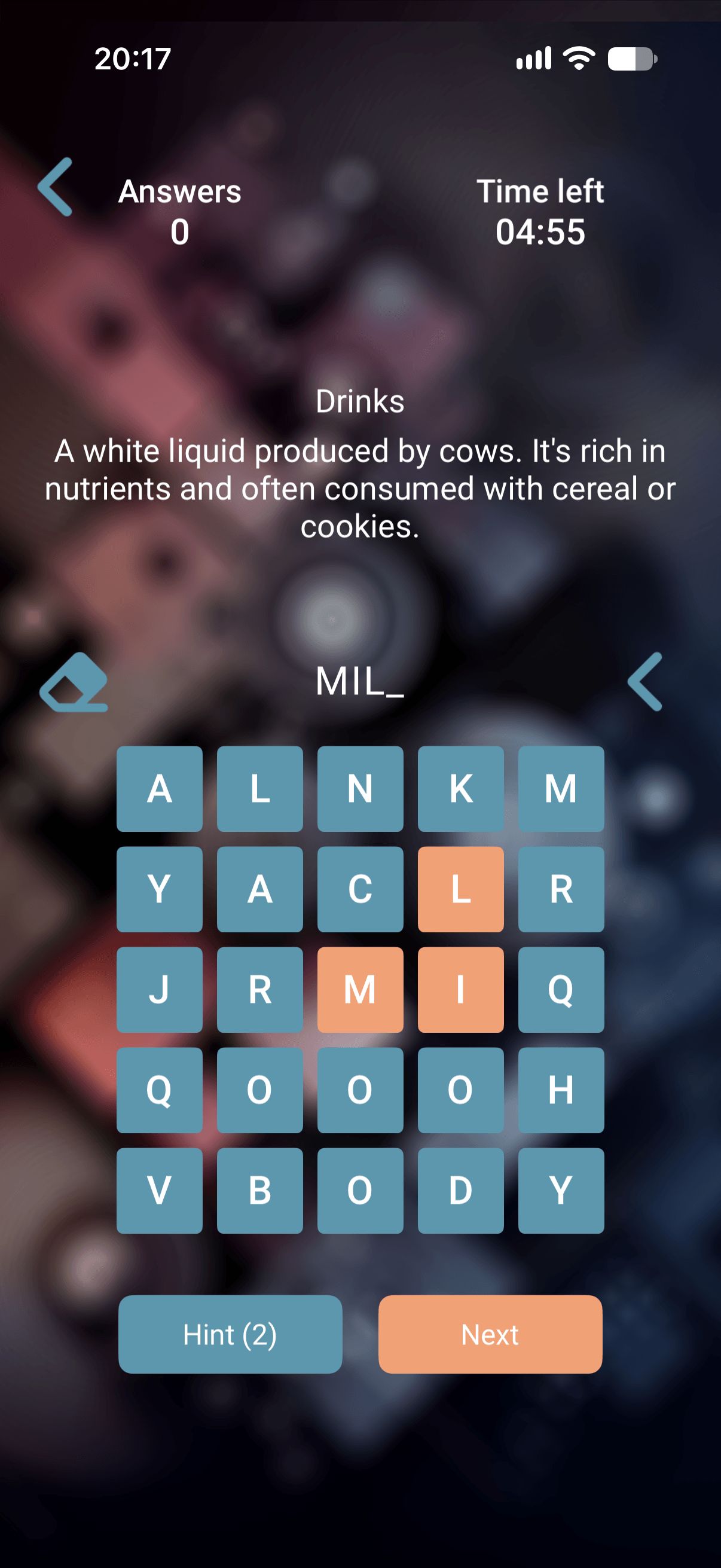 Game screen with the clue "A white liquid produced by cows", the answer MIL partly typed, and a 5×5 letter grid